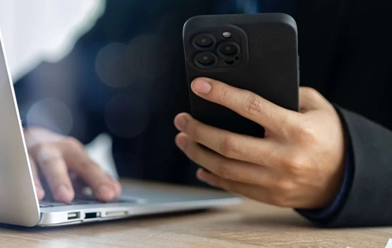 Close up of a hand, holding a mobile phone 